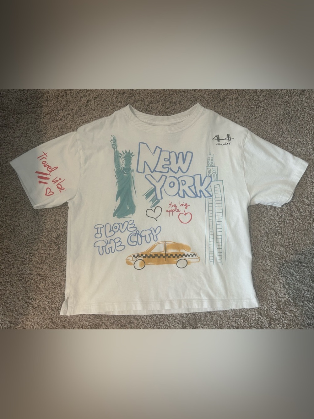 Zara White Kids New York Graphic Tee with Teal Statue and Orange Taxi